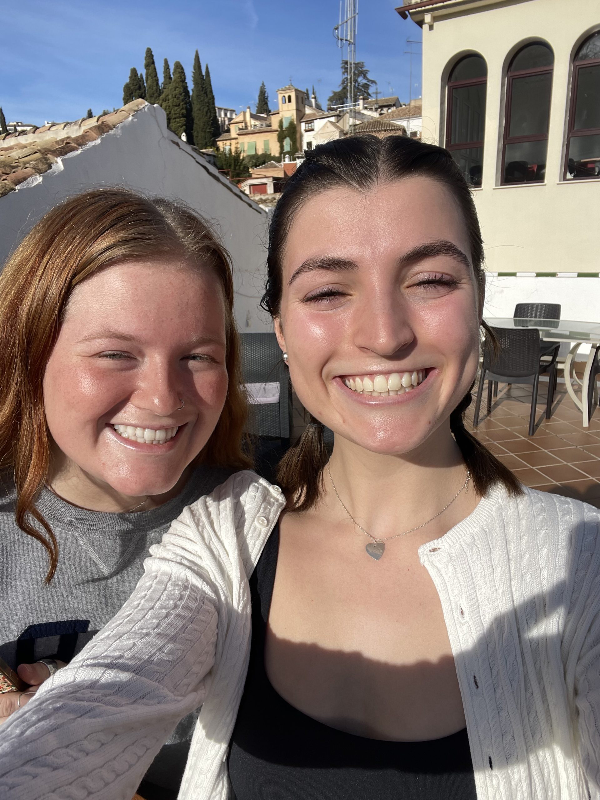 A selfie of two girls outside.