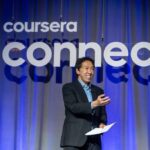 Coursera Co-founder Andrew Ng announces a Coursera award winner from the stage